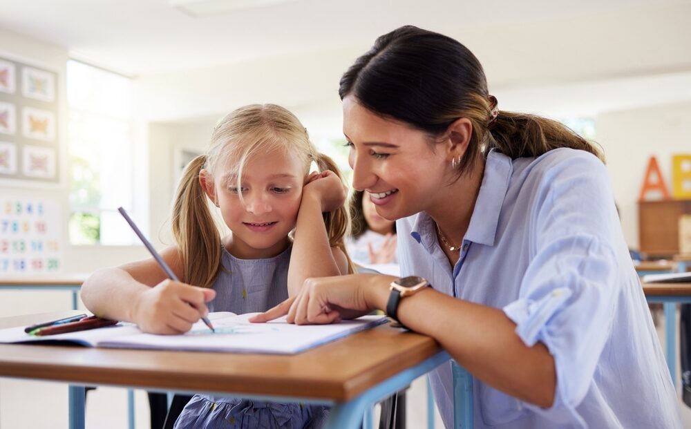Teacher,,Learning,And,Helping,Girl,In,Classroom,For,Drawing,,Studying